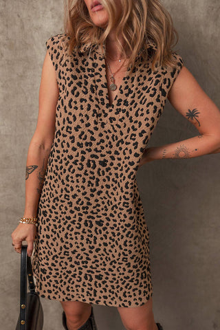 This light brown leopard print sleeveless, V-neck, collared dress also has pockets and is mid-thigh length