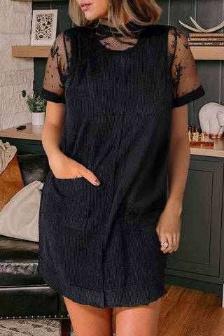 black corduroy mini dress with front pockets.  material is light weight and 2 front pockets.   Also, sleeveless