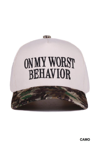 Cap with 'On My Worst Behavior' text and camouflage bill on a white background