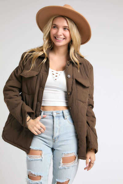 brown puffy button up jacket.  With 2 chest pockets and side hand pockets too