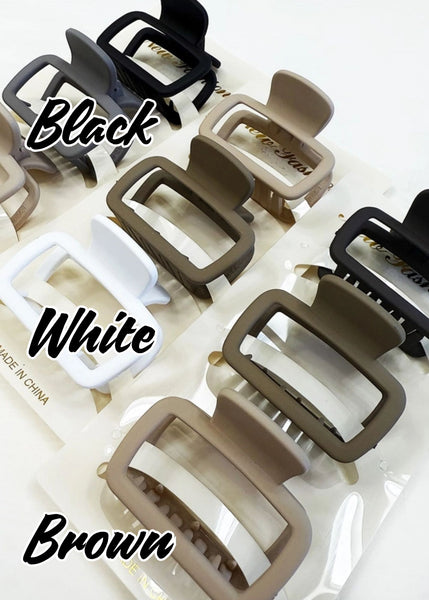 matt finish medium sized neutral tone hair clips in packs of 3.  Black, white, and brown