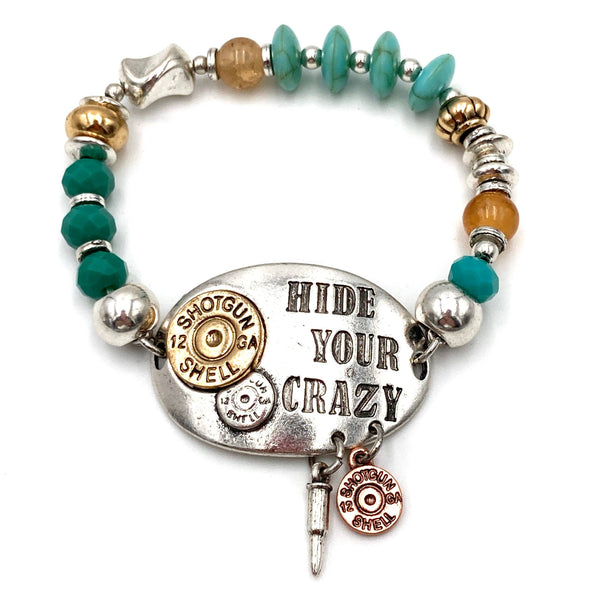 This bracelet adorns multi color beads in silver, gold and turquoise with an emblem that "Hide your Crazy" with charms of small shotgun bullets