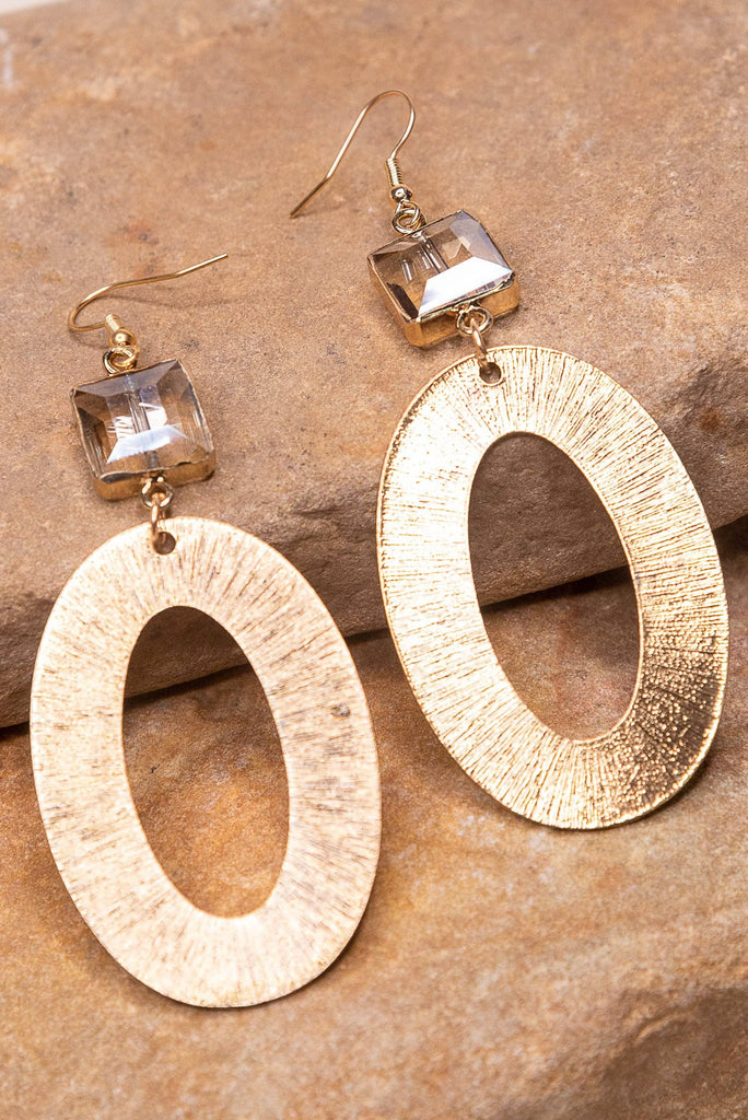 fishhook earrings with textured metal oval hoop and crystal charm. 3" off the drop with fishhook earring closure. Crystal Charm