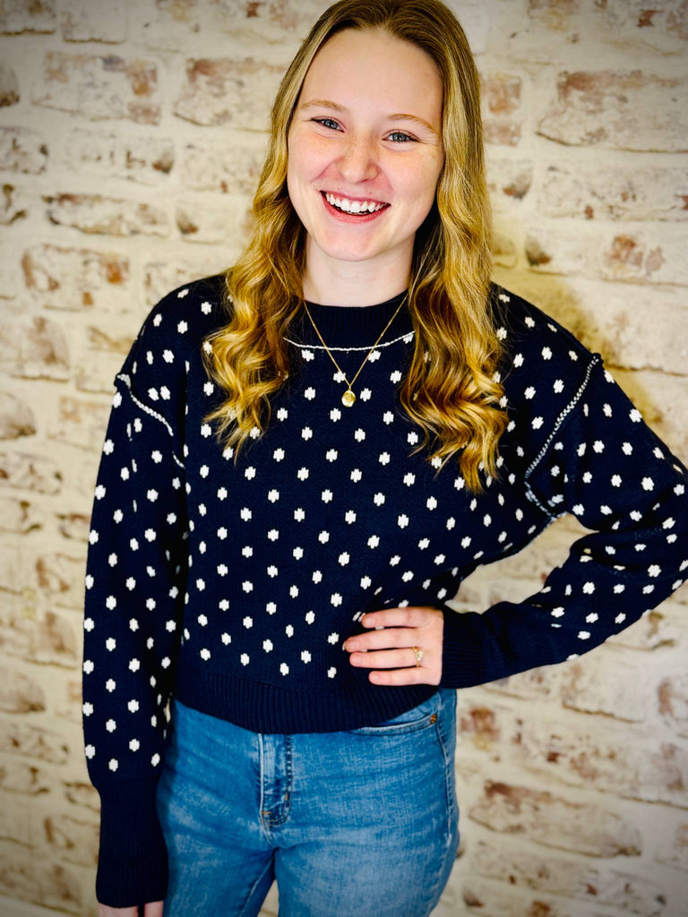 navy blue sweater with white snowflakes