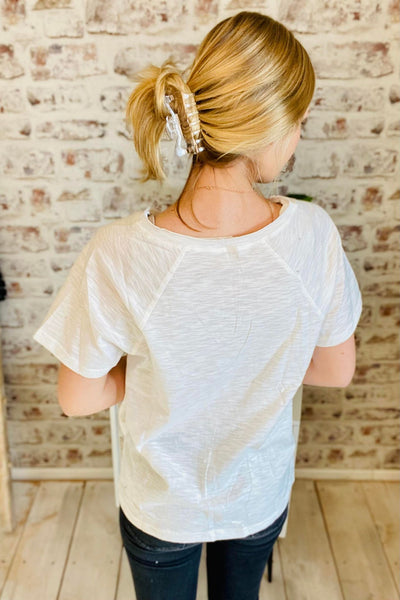 Woman wearing Basic V-Neck White Tee with a pocket