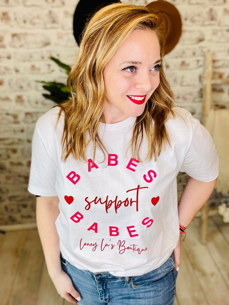 Woman wearing Babes Support Babes White T-Shirt with Pink Lettering