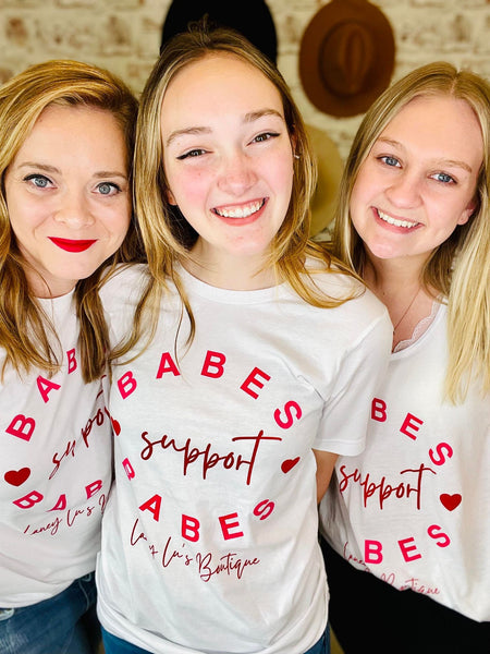 Women wearing Babes Support Babes White T-Shirt with Pink Lettering