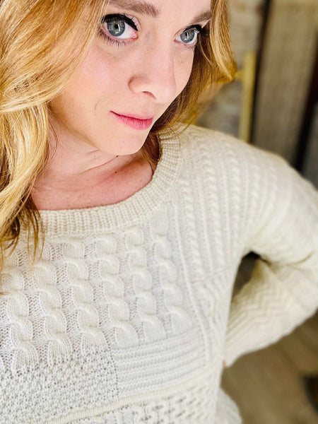 Woman wearing Cream Knit Sweater with a tie in the back
